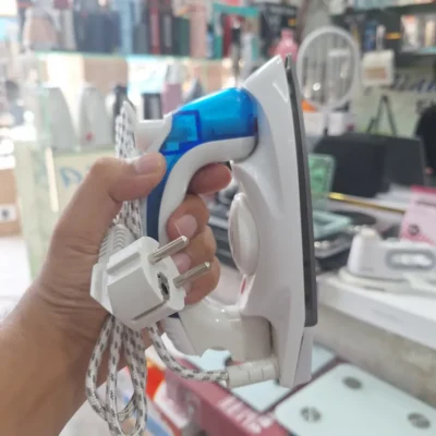 Foldable travel iron with steam spray function