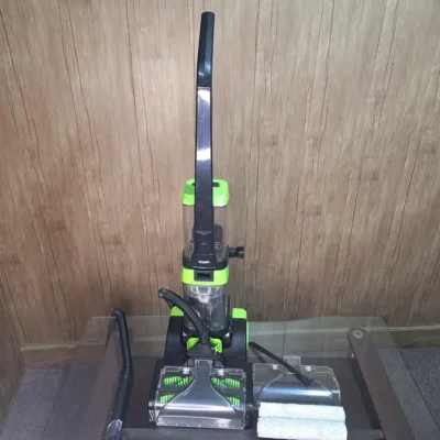 BOMA carpet washer standing upright on glass table