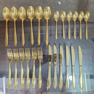 AVD 24 piece gold cutlery set full set laid out on table