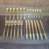 Overhead view of full AVD 24 piece gold cutlery set