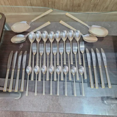 Overhead view of full AVD 36 piece cutlery set with serving pieces