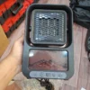 Portable flame-effect fan heater front view with heating grille