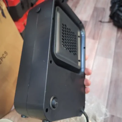 Portable fan heater top view showing air outlet and power switch