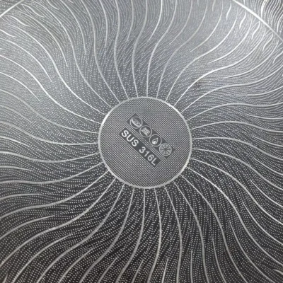 Tava - Wooden Handle 34cm - Laser-Etched Surface Detail Lazer coated tava laser-etched non-stick surface texture close-up