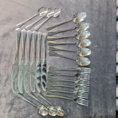 Alomi 32 piece cutlery set full set laid out on table