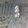 Close-up of Alomi cutlery set handle pattern