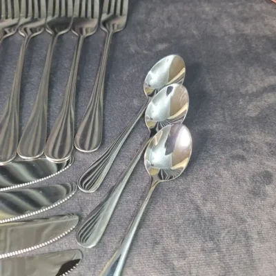 Close-up of Alomi cutlery set handle pattern