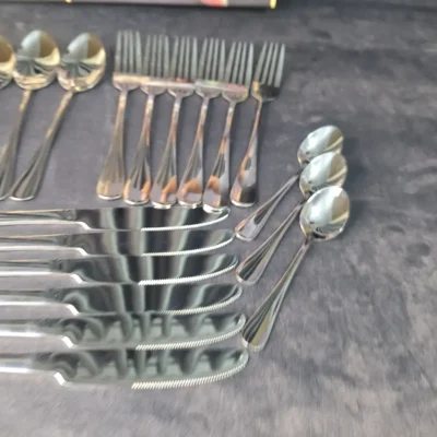 Close-up of Alomi cutlery set knives and forks