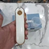Uakeen ZL-227 folding travel iron power button close-up