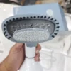 Uakeen ZL-220 garment steamer shown in use on hanging fabric