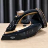 Uakeen ZL-830 steam iron angled view with UAKEEN branding
